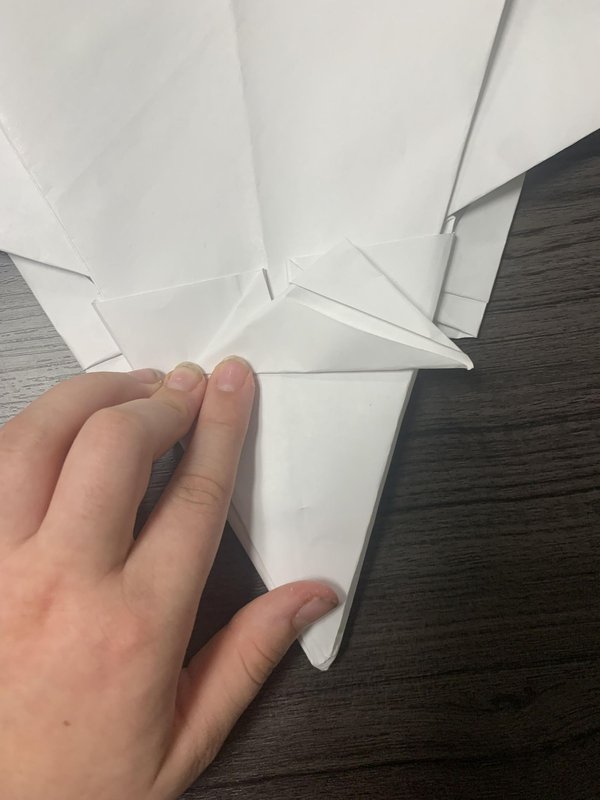 접은 다음, 또 다른 토끼 귀 모양으로 접으세요.